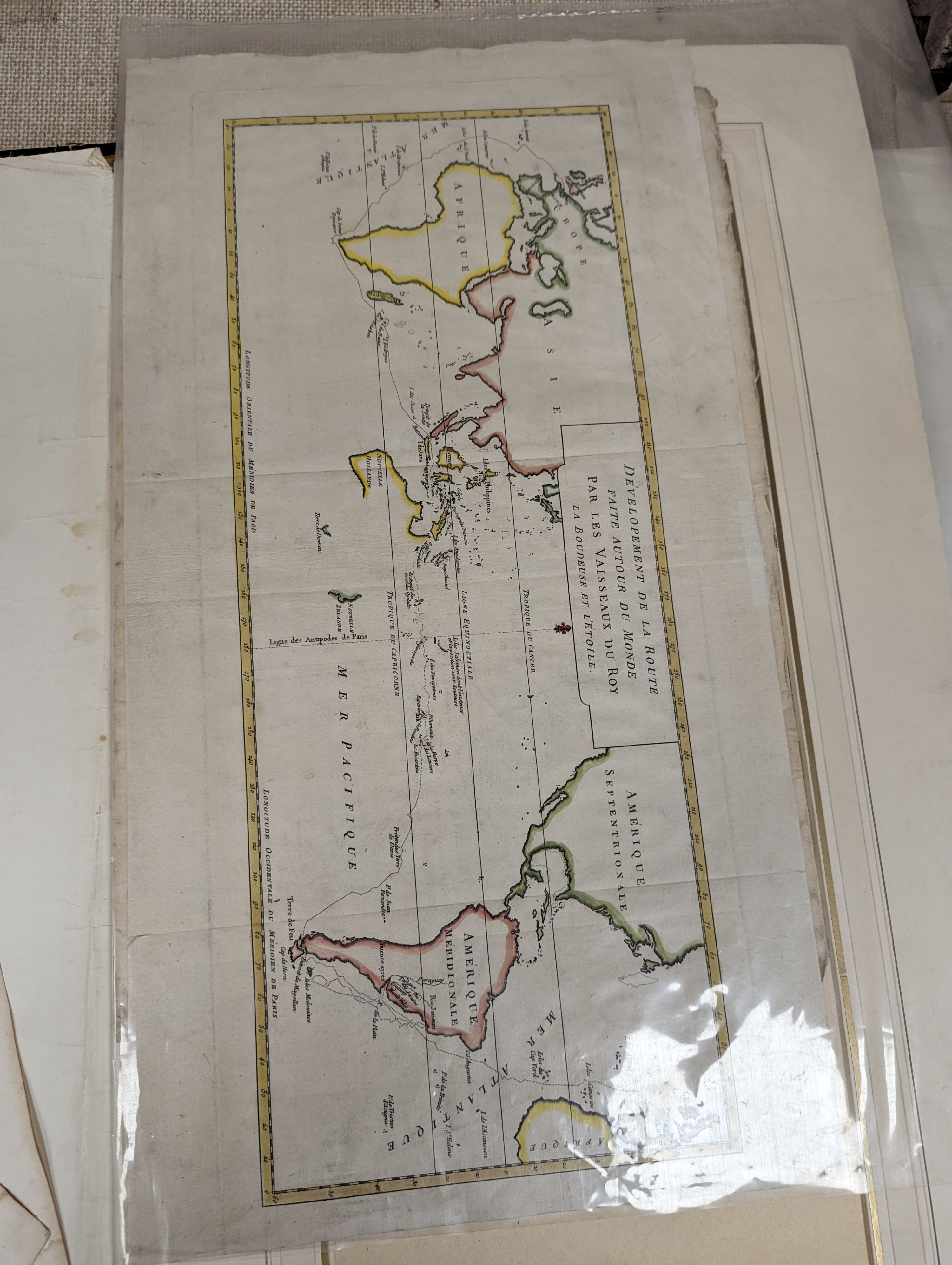 A folio of 18th/19th century maps and scientific engravings, including an engraving after Ludovico Lanberti, a map of the World plotting Bourgainvilles voyage of 1772